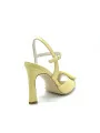 Yellow leather sandal with “buckle” accessory. Leather lining. Leather sole.
