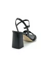 Black leather and glittery fabric sandal with intertwined band. Leather lining. 