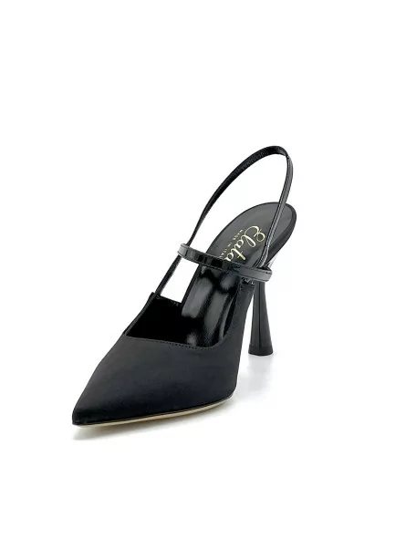 100% black silk and patent leather slingback with black enameled heel. Leather l