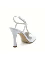 White leather sandal with T-strap. Leather lining. Leather sole. 9,5 cm heel.
