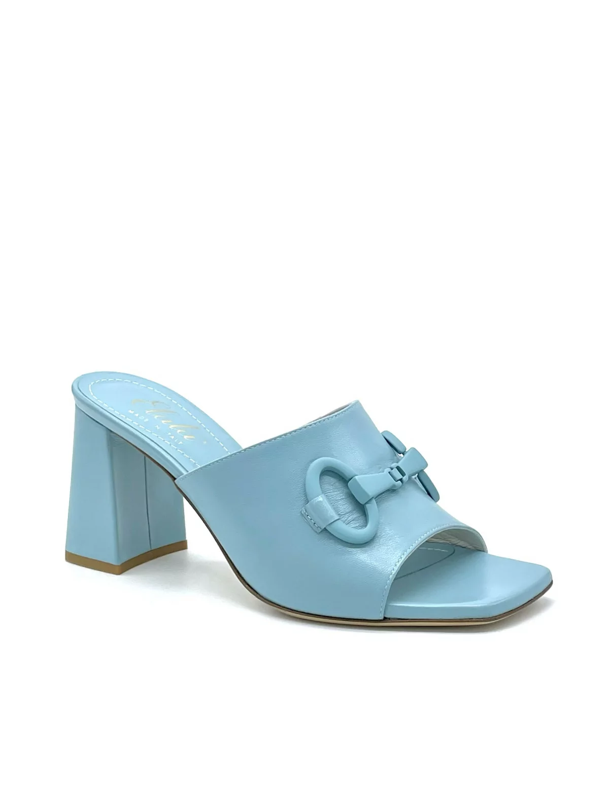 Light blue leather mule with matching clamp accessory. Leather lining. Leather s