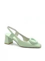 Green leather slingback with matching “circle” accessory. Leather lining. Le
