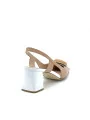 Tan and white leather slingback with matching “circle” accessory. Leather li