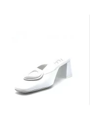White leather mule with matching “circle” accessory. Leather lining. Leather