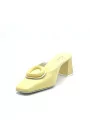 Yellow leather mule with matching “circle” accessory. Leather lining. Leathe