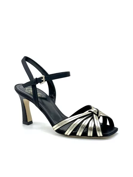 100% black silk and gold laminate leather sandal with knotted bands. Leather lin