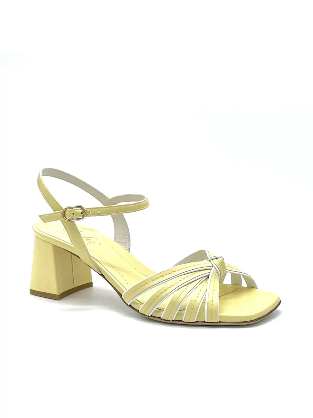 Yellow and white leather sandal with knotted bands. Leather lining. Leather sole