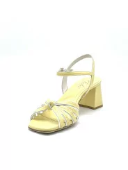 Yellow and white leather sandal with knotted bands. Leather lining. Leather sole
