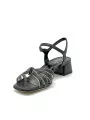 Black and white leather sandal with knotted bands. Leather lining. Leather sole.