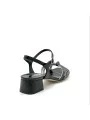 Black and white leather sandal with knotted bands. Leather lining. Leather sole.
