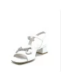 White leather sandal with silver accessory. Leather lining. Leather sole. 3,5 cm
