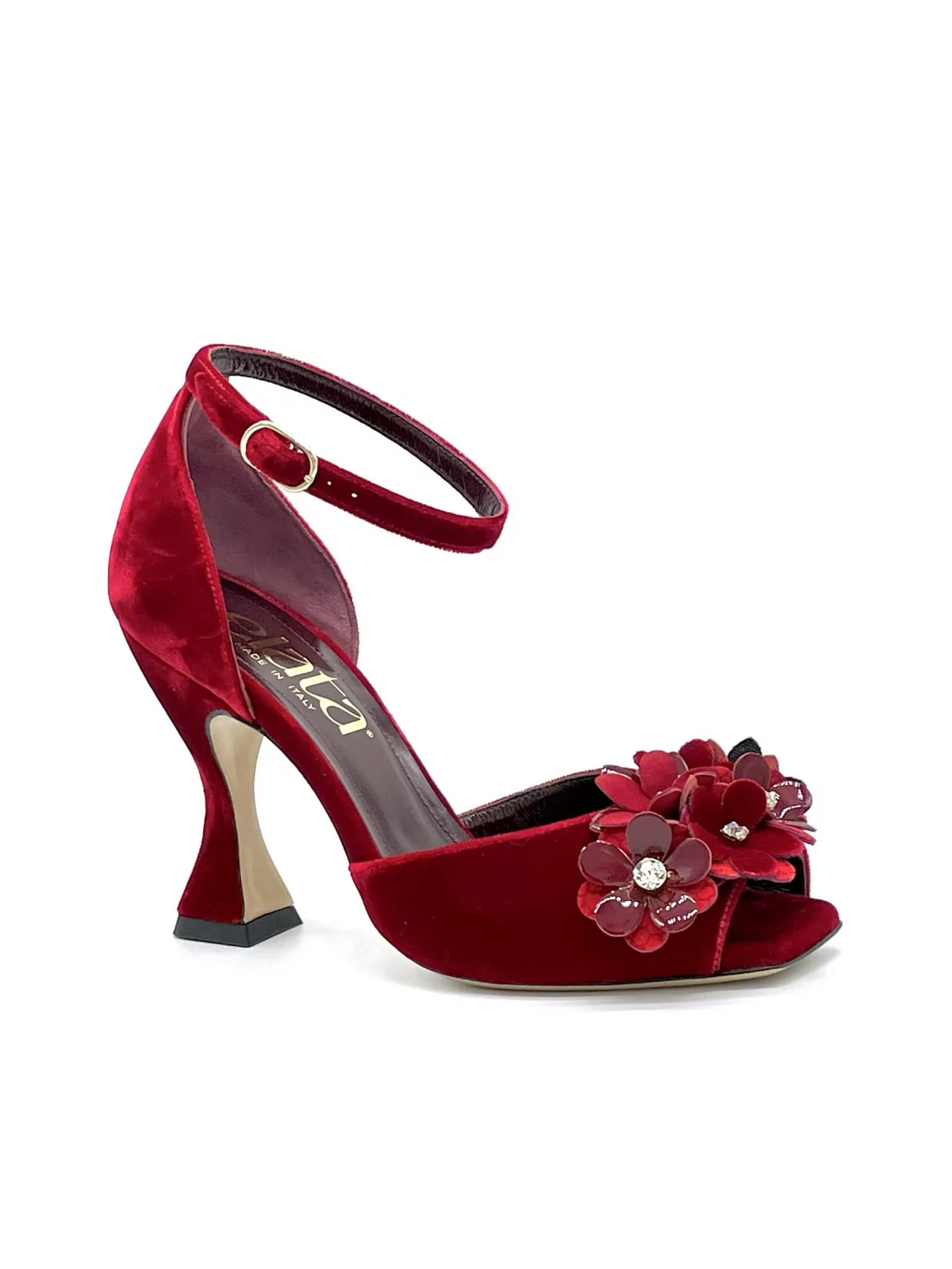 Red velvet sandal with red velvet and patent flower accessory with studs. Leathe