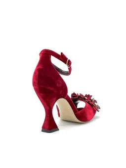 Red velvet sandal with red velvet and patent flower accessory with studs. Leathe