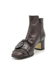 Brown leather boot with gunmetal color buckle. Leather lining, leather and rubbe