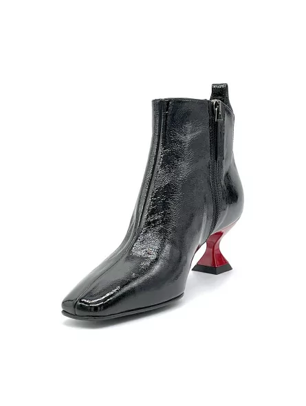 Black patent with creased effect boot and red enameled heel. Leather lining, lea