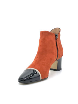 Pumpkin suede and black patent boots with beige grosgrain ribbon. Leather lining