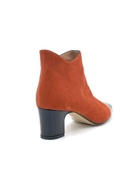 Pumpkin suede and black patent boots with beige grosgrain ribbon. Leather lining