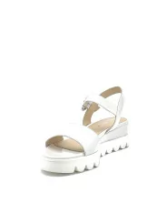 Milk leather sandal with jewel buckle. Leather lining, leather covered wedge and