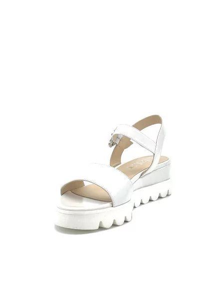 Milk leather sandal with jewel buckle. Leather lining, leather covered wedge and