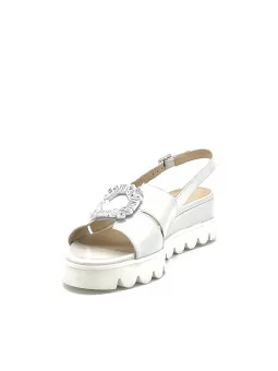 Milk color leather sandal with jewel accessory. Leather lining, leather covered 